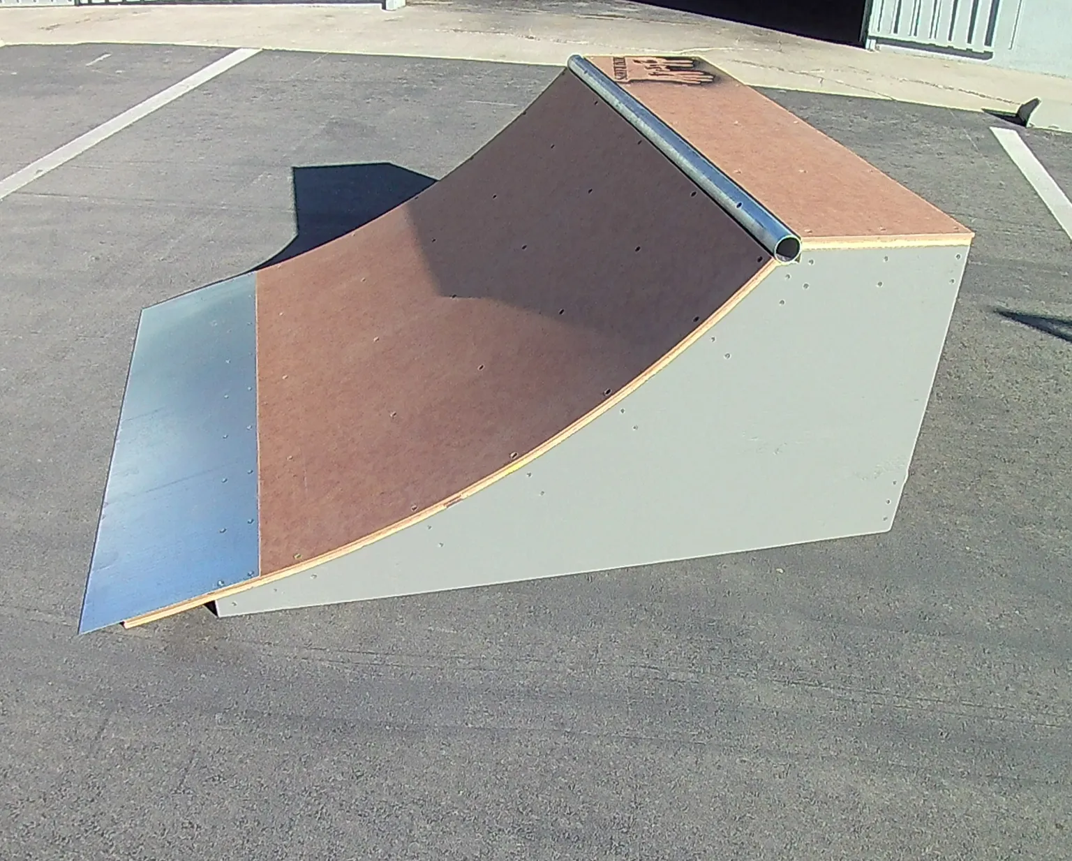 Side view of two foot high by four foot wide quarter pipe