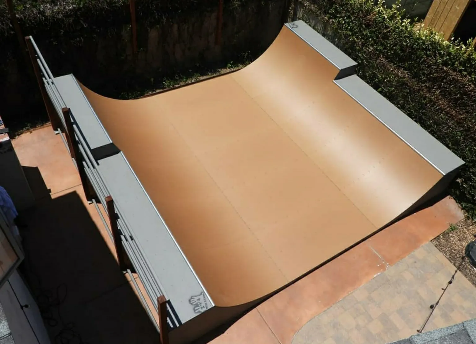 Aerial view of three and a half foot high miniramp in large yard