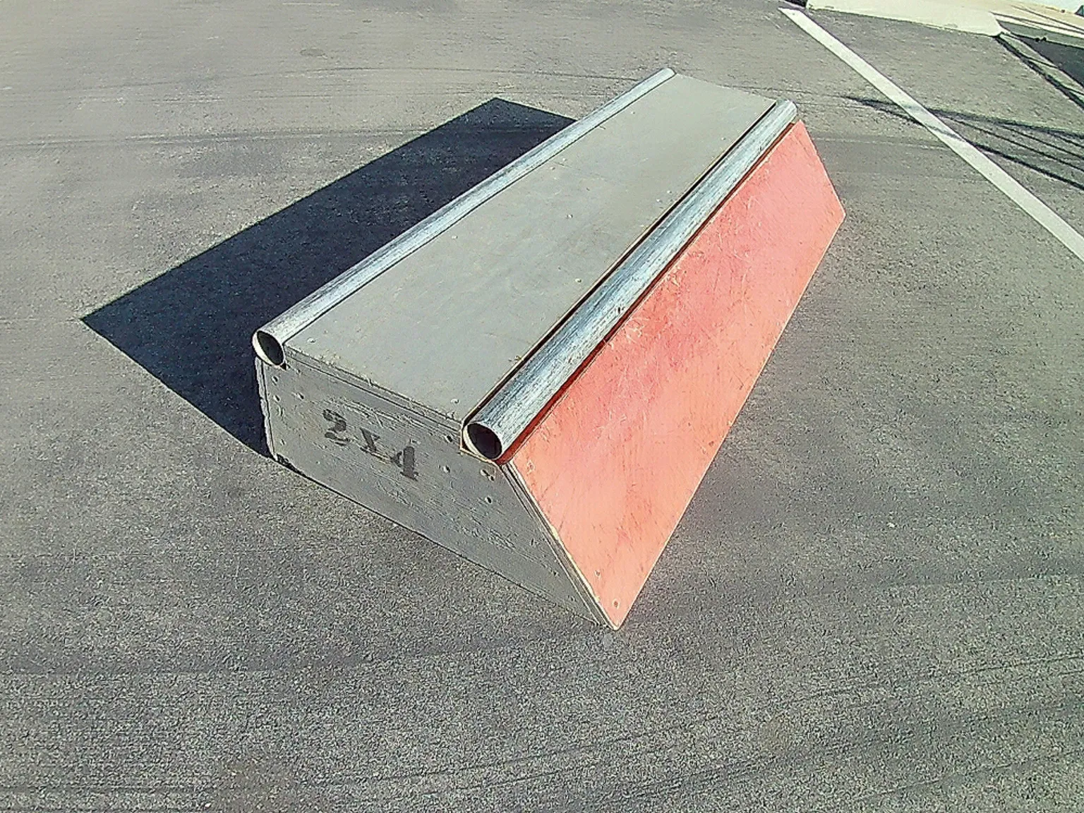 Slappy curb grind box on asphalt, front view