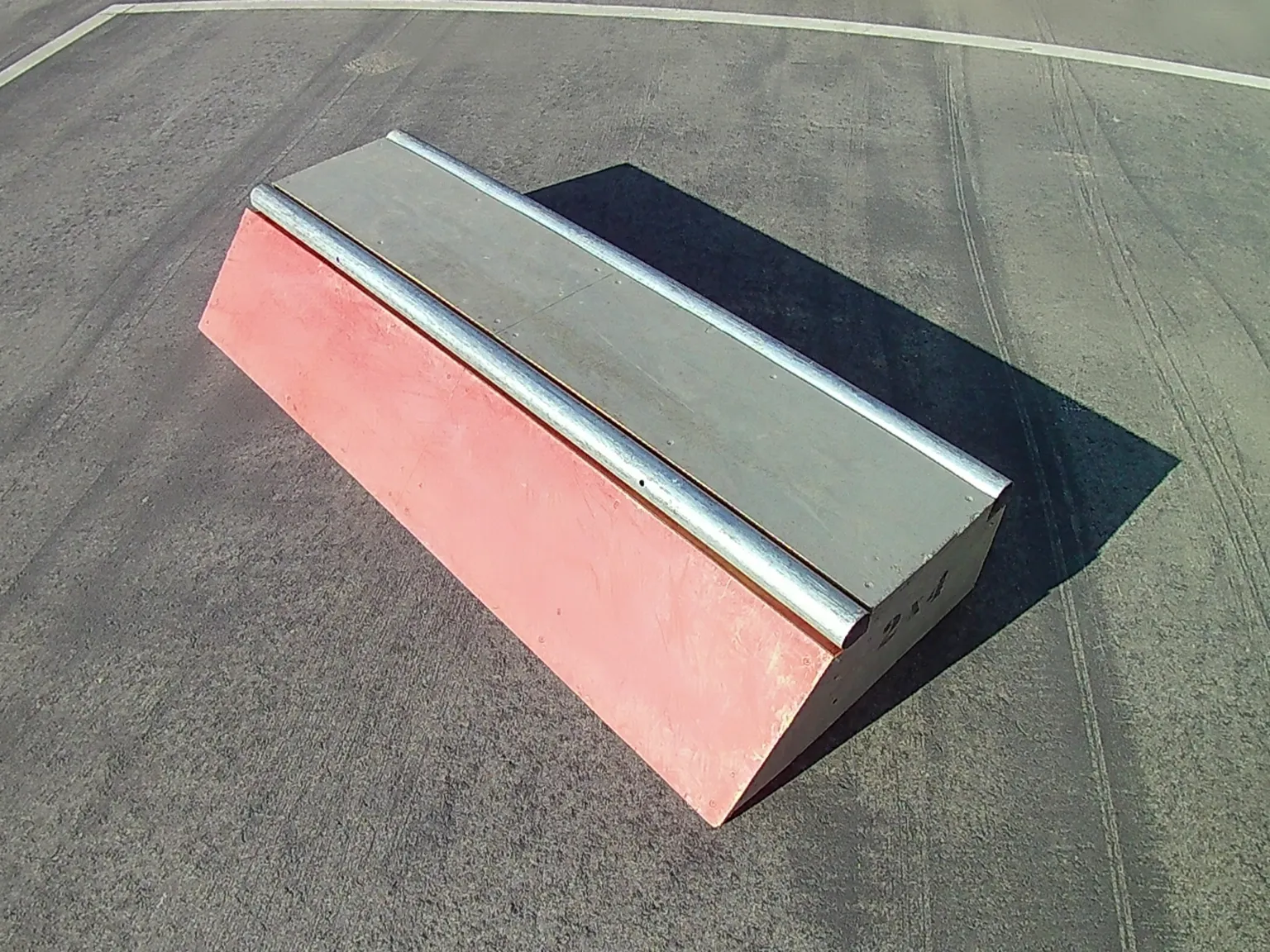 Slappy curb grind box on asphalt, side view